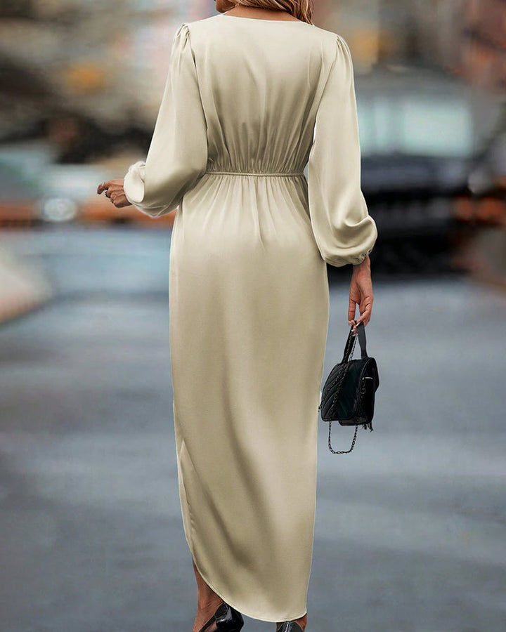 Women's beige V-neck midi dress with elegant lantern sleeves. A-line silhouette, perfect for chic seasonal fashion.