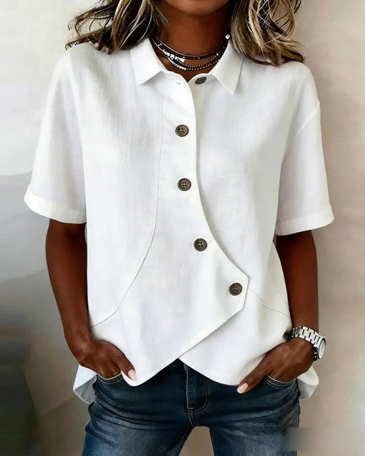 Women's elegant asymmetrical button-down blouse with long sleeves, perfect for smart casual fashion.