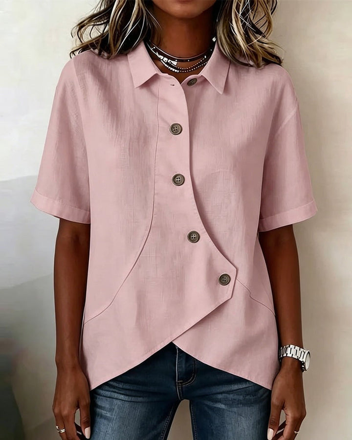 Comfortable women's relaxed fit blouse, featuring an asymmetrical button-down placket and long sleeves.
