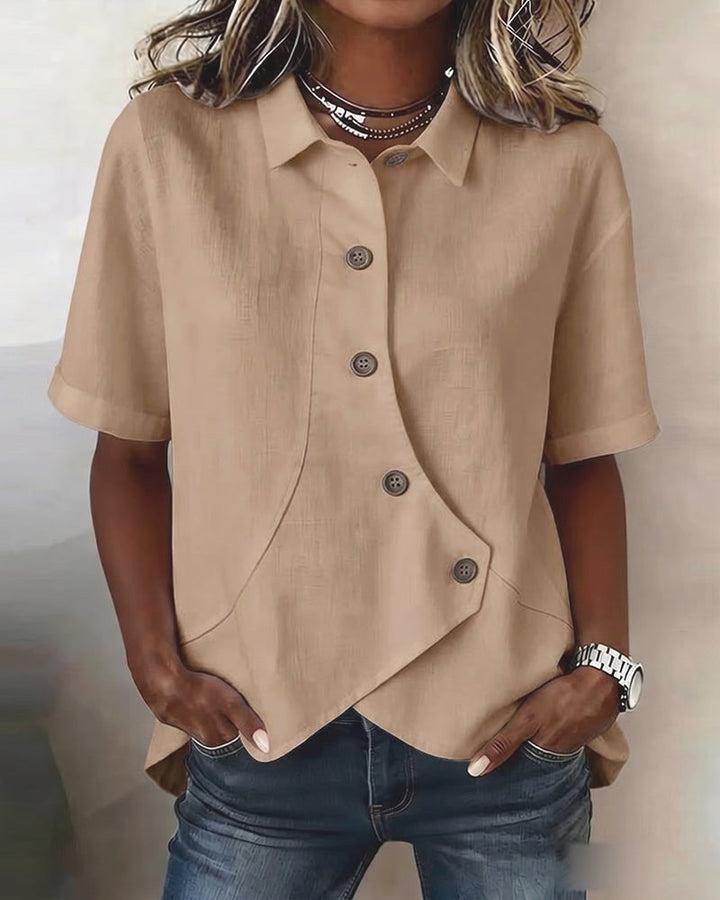Modern women's button-down blouse, a versatile long sleeve top with an elegant asymmetrical design.
