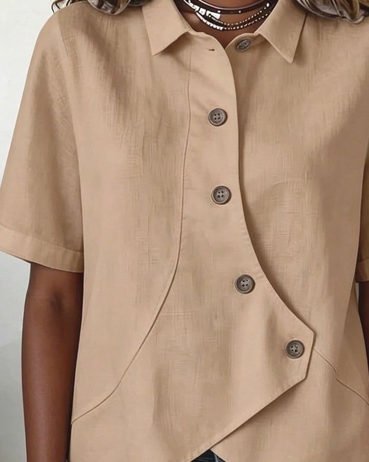 Sophisticated women's asymmetrical blouse, a smart casual button-down top for versatile wear.