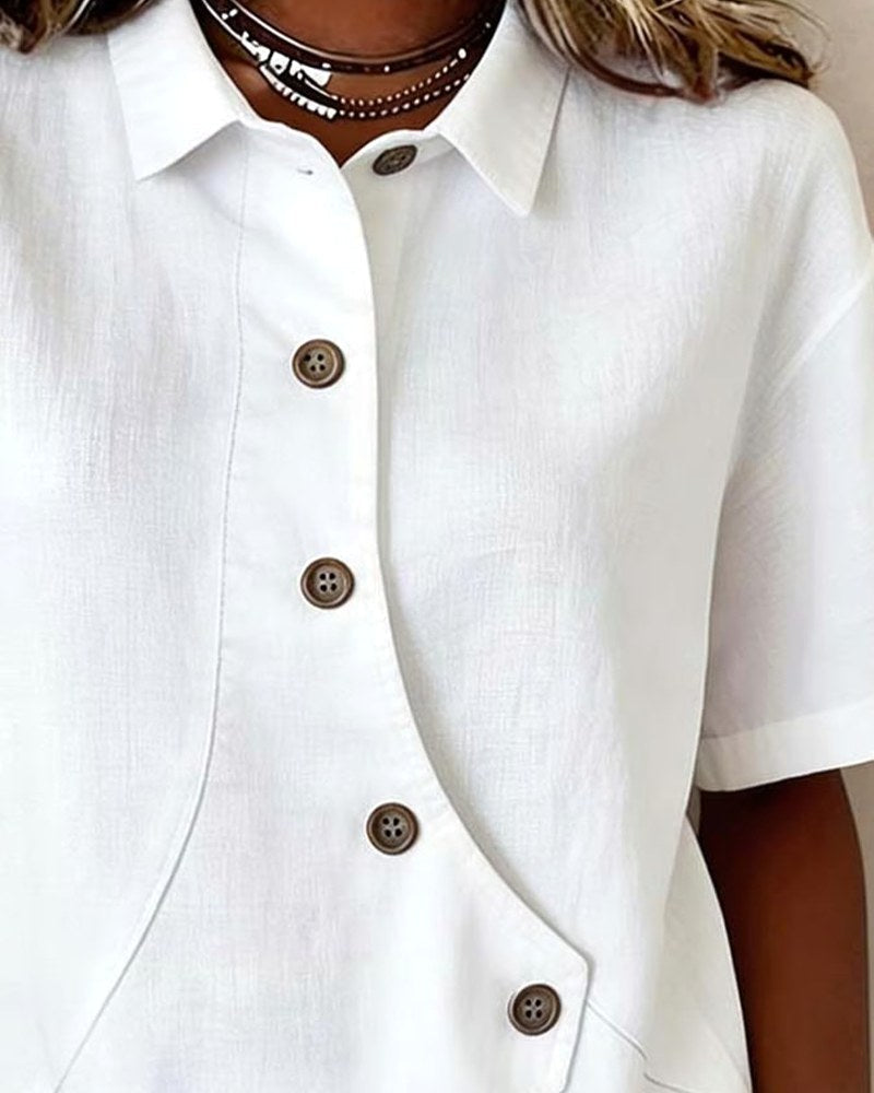 Stylish women's relaxed fit shirt blouse featuring a unique asymmetrical placket design.