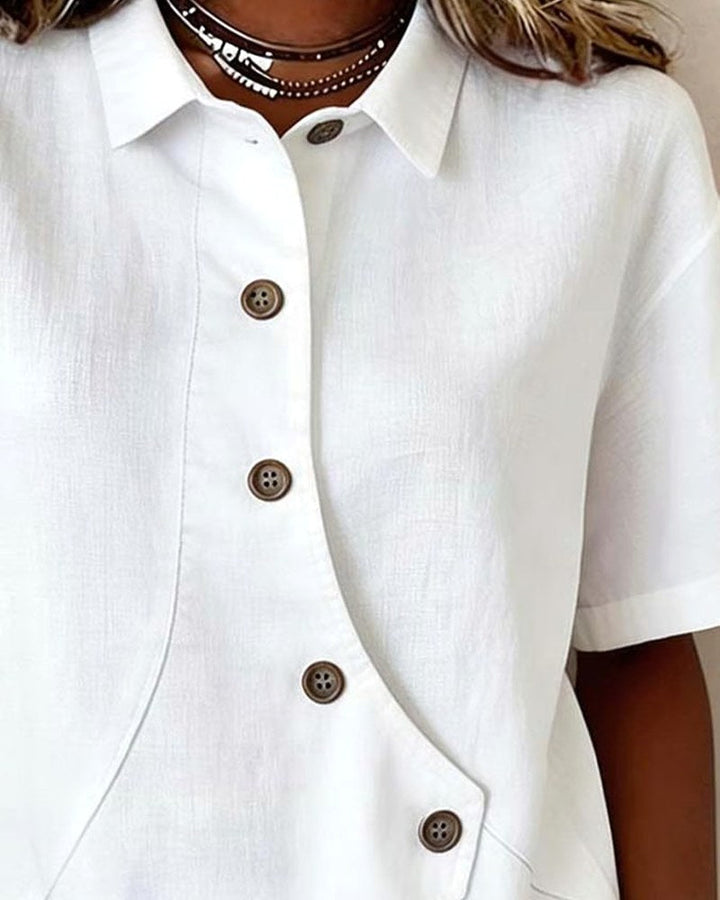 Stylish women's relaxed fit shirt blouse featuring a unique asymmetrical placket design.