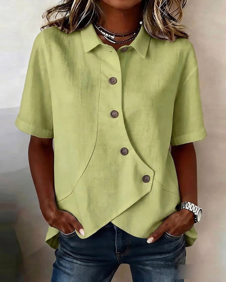 Fashionable women's blouse with an asymmetrical placket, ideal for a modern, elegant look.