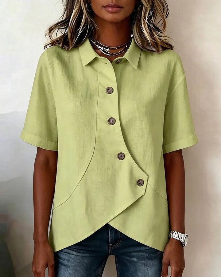 White women's asymmetrical button-down shirt, a smart casual top with long sleeves.