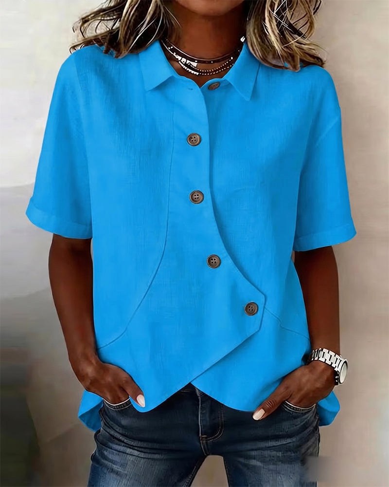 Relaxed fit women's asymmetrical button-down shirt, an elegant top for sophisticated fashion.