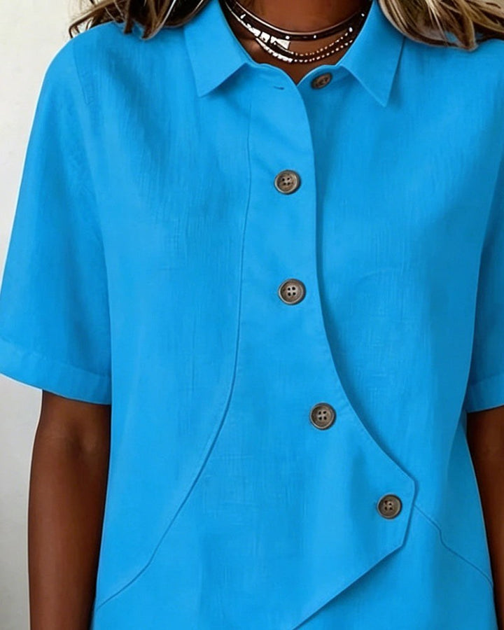 Chic women's shirt: asymmetrical design, long sleeves, and button-down front for versatile styling.