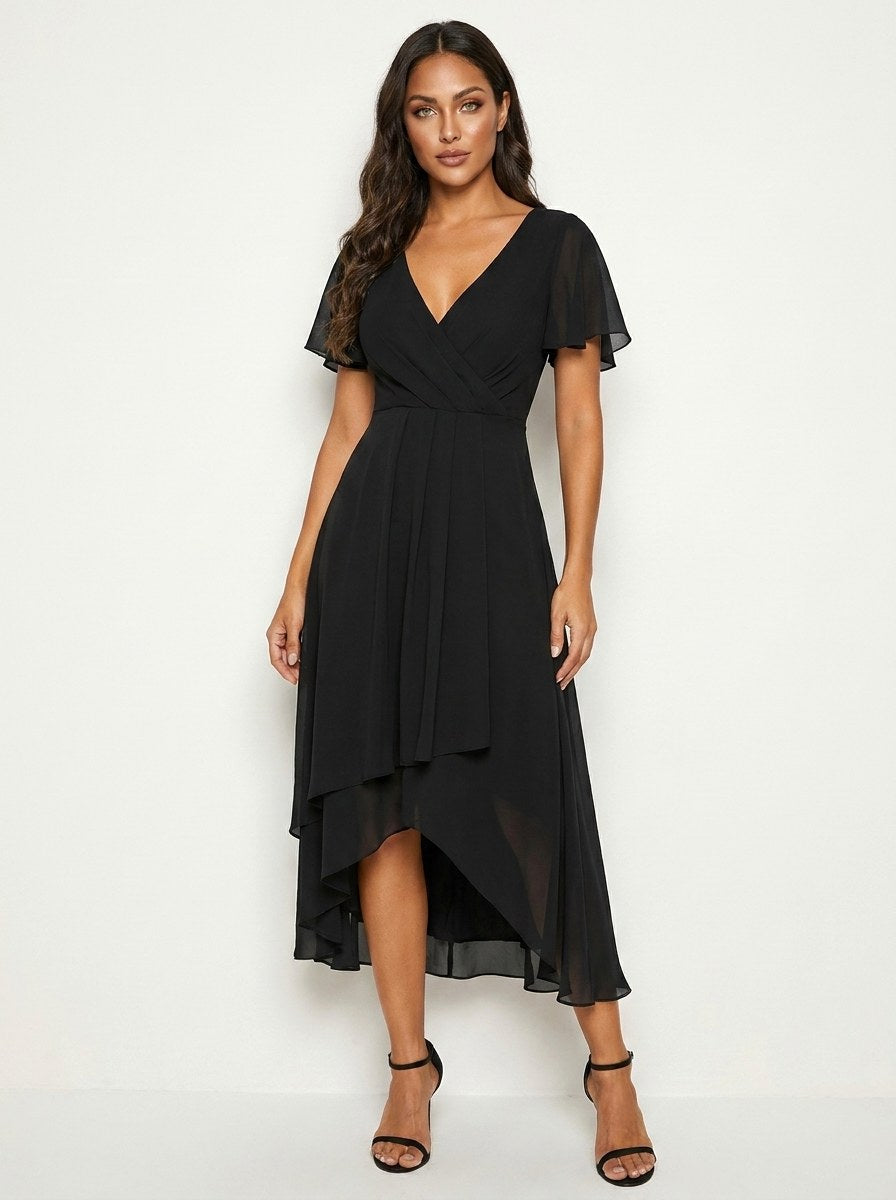 Women's elegant midi dress with delicate embellishments, perfect for special occasions.