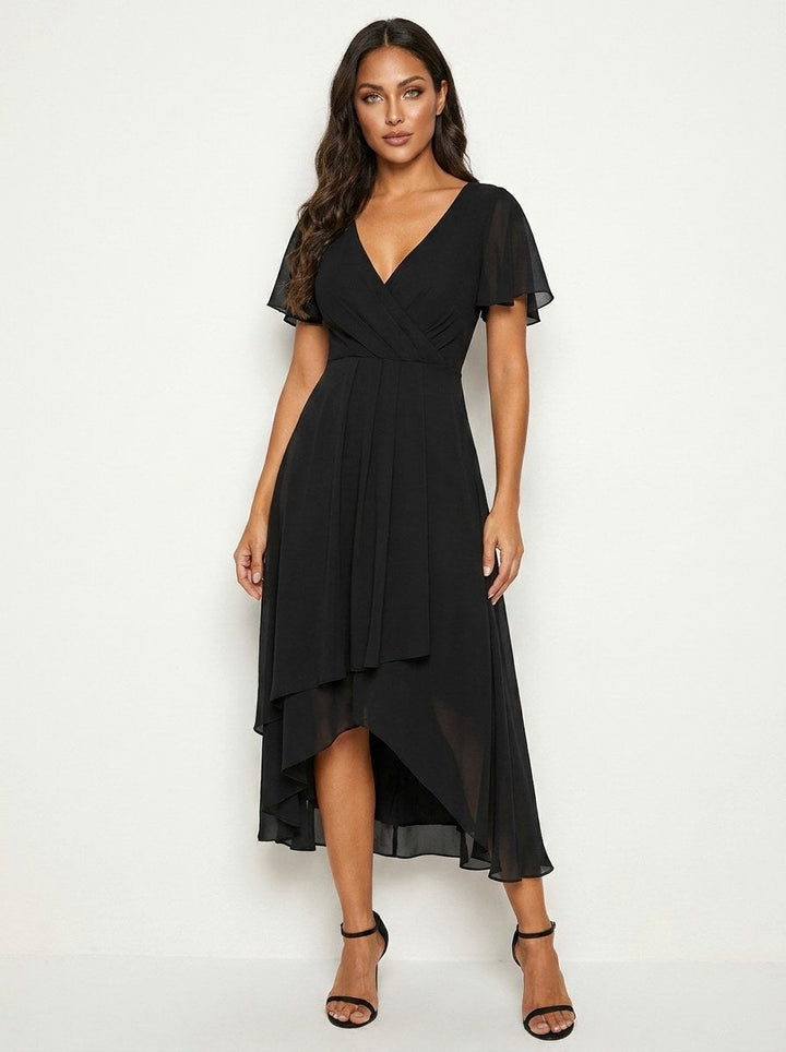 Women's elegant midi dress with delicate embellishments, perfect for special occasions.