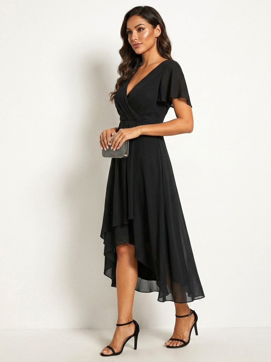 Close-up of delicate embellishments on an elegant women's midi dress. Ideal for party wear.