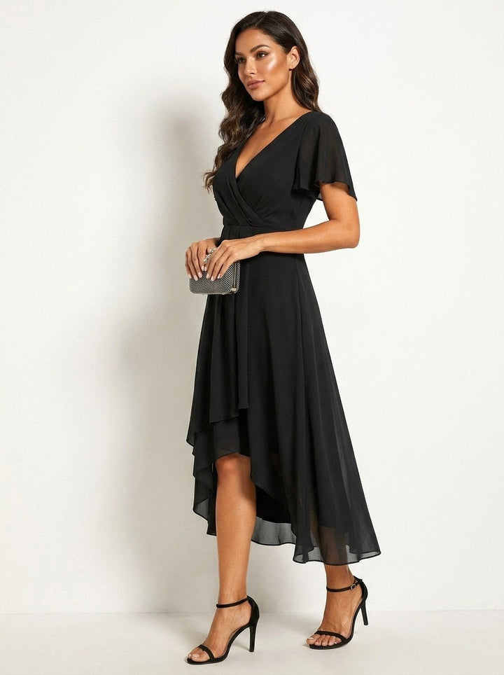 Close-up of delicate embellishments on an elegant women's midi dress. Ideal for party wear.