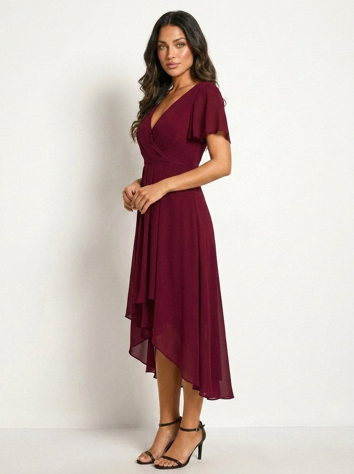 Black elegant women's midi dress featuring delicate embellishments, perfect for evening events.