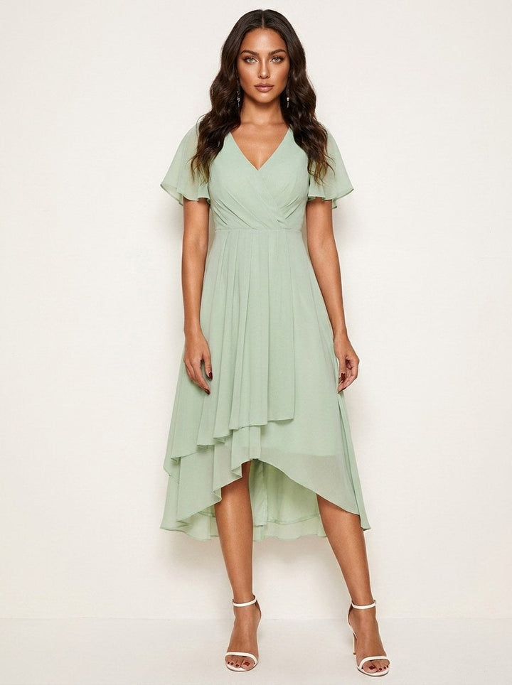 Green elegant women's midi dress with subtle embellishments, ideal for summer occasions.
