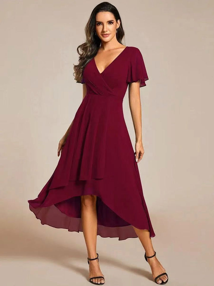 Flattering midi-length women's dress with delicate embellishments, offering an elegant formal look.