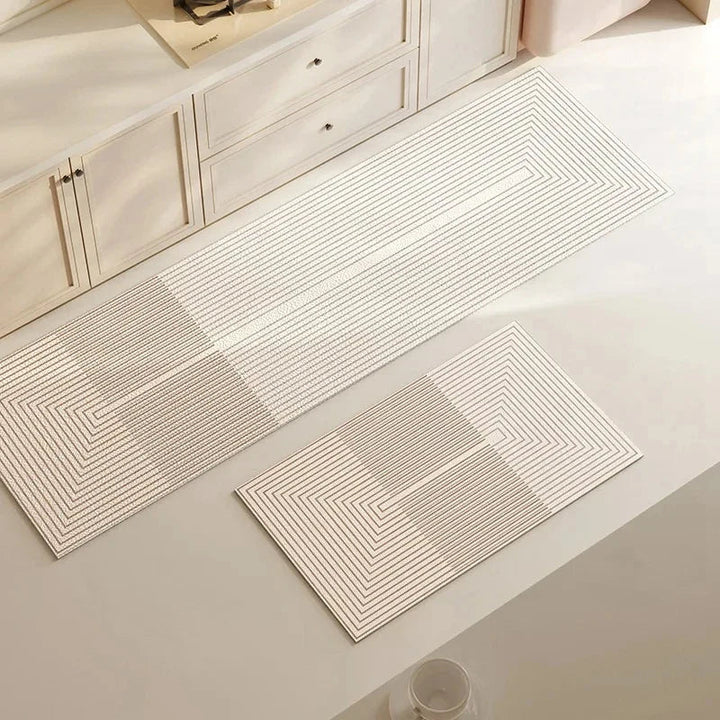 Cushioned anti-fatigue kitchen mat, non-slip & absorbent, perfect for prolonged standing in kitchen decor.