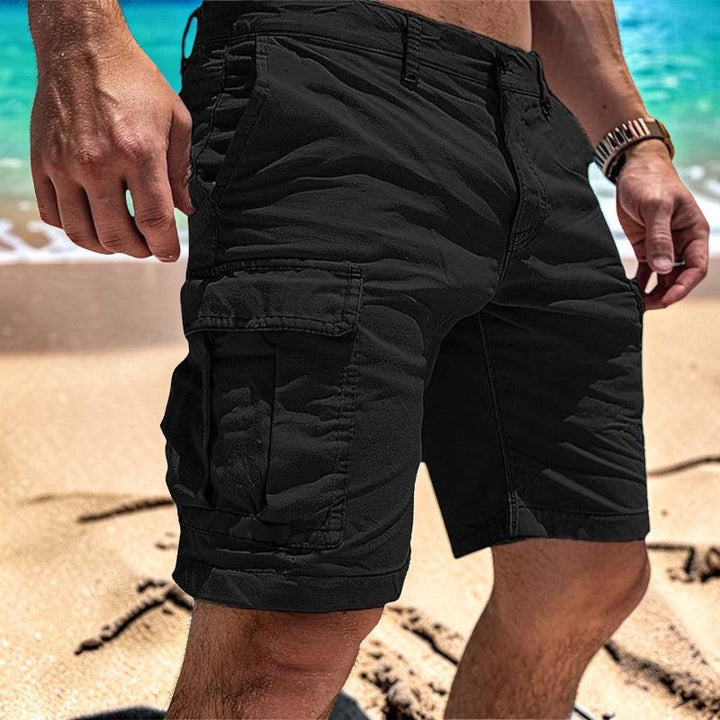 Men's multi-pocket outdoor shorts, knee-length for freedom of movement. Comfortable & practical for summer activities.