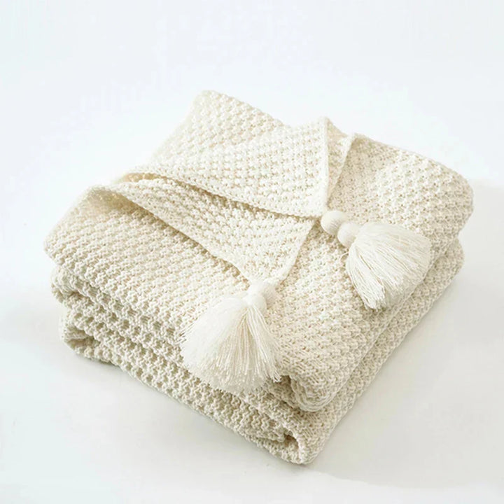Warm knitted wool blanket, tassel detail, perfect for sofa or bed decorative styling.