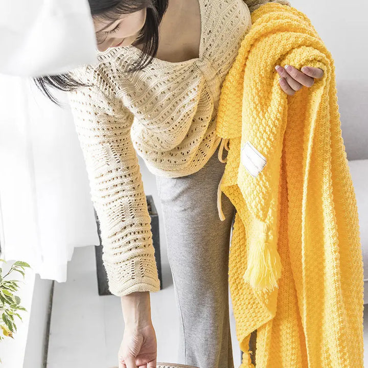 High-quality knitted wool throw, soft & warm, a perfect decorative addition to home.