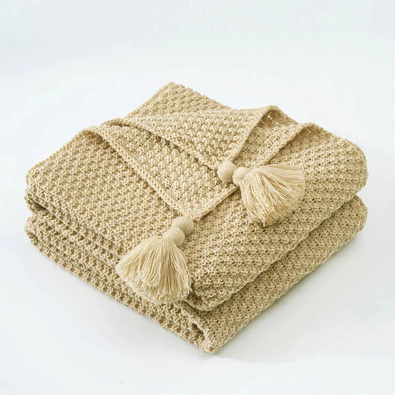 Cozy wool throw, hand-knitted look, adds rustic charm to your living room space.
