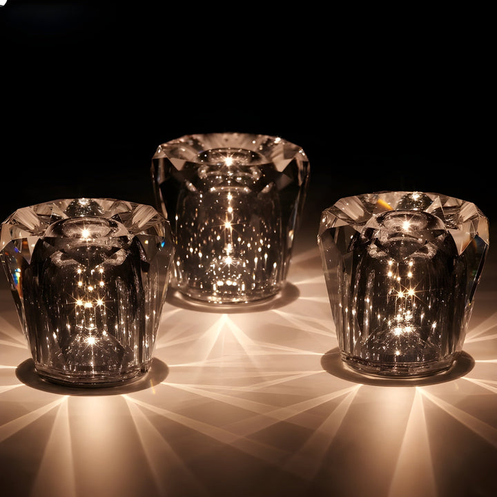 Crystal table lamp with diamond facets, rechargeable LED lighting, versatile decor piece.