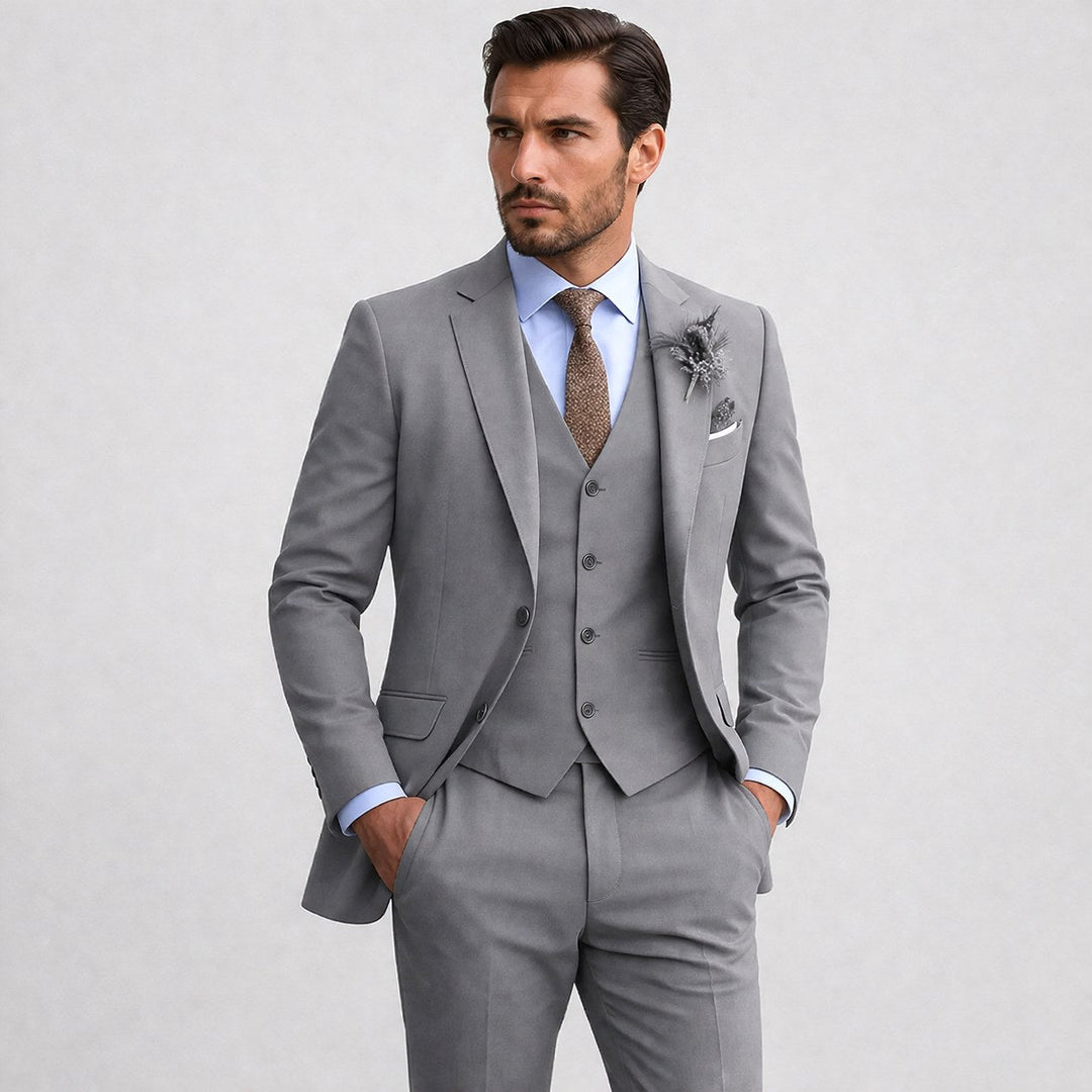 Classic men's three-piece suit, including a stylish blazer, waistcoat, and tailored trousers.
