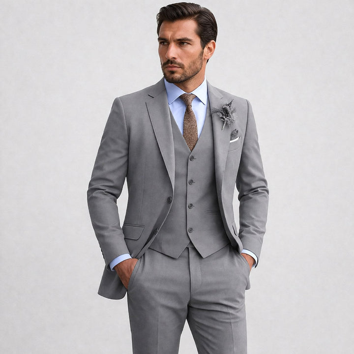 Classic men's three-piece suit, including a stylish blazer, waistcoat, and tailored trousers.