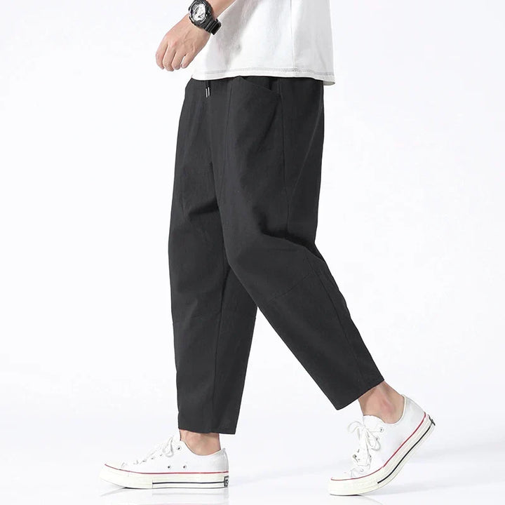 Comfortable men's relaxed fit cropped drawstring pants, perfect for versatile summer casual wear or streetwear.
