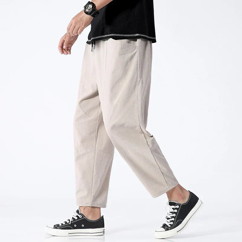 Stylish men's cropped pants, relaxed fit with a functional drawstring waist, great for everyday comfort & style.