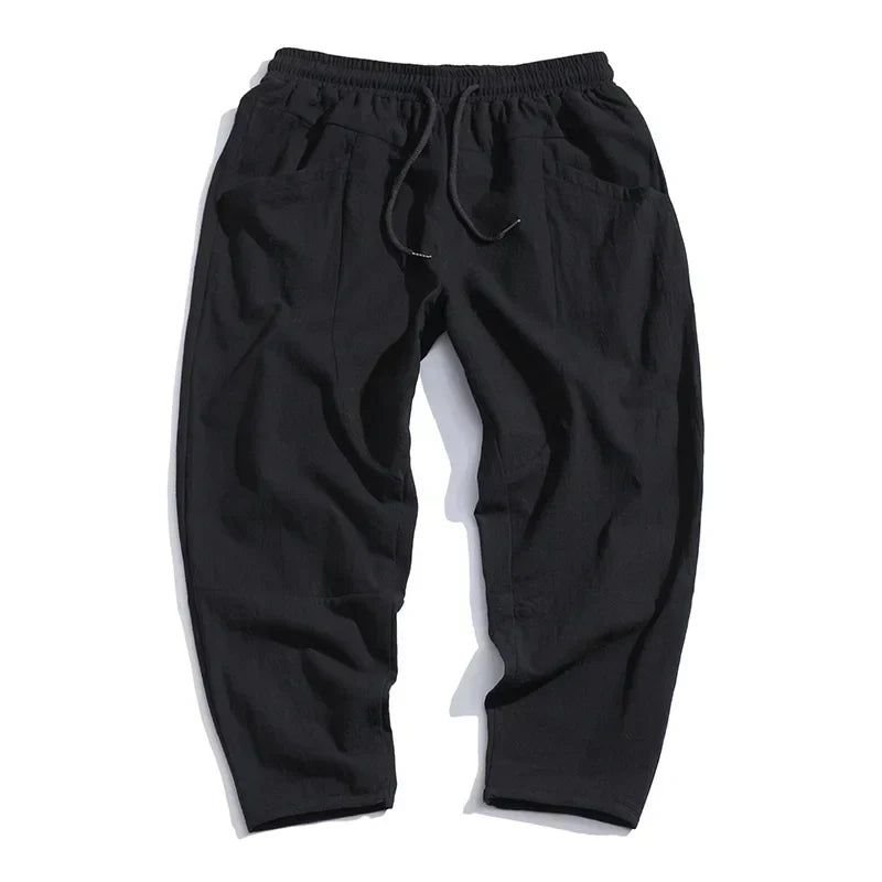 Versatile men's relaxed fit drawstring cropped pants, perfect for comfortable summer wear, streetwear, or daily tasks.