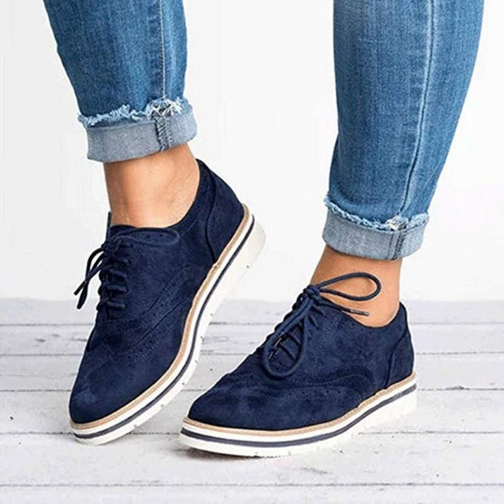Women's platform lace-up oxford shoes. Elegant wingtip style, versatile for both casual & formal outfits.