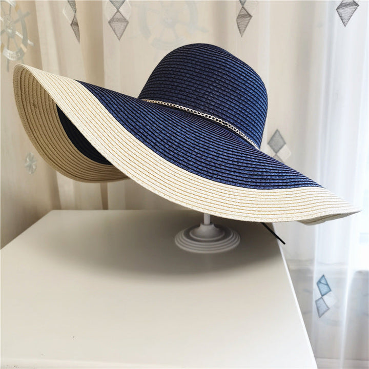 Elegant women's wide brim sun hat, lightweight & breathable, offering stylish UV protection for summer.