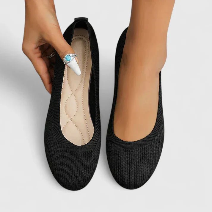 Supportive women's walking flats with arch support, ergonomic design for comfortable daily strolls.
