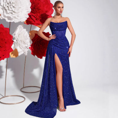 Elegant mermaid silhouette sequin gown with a daring high slit & supportive corset waist for black-tie events.