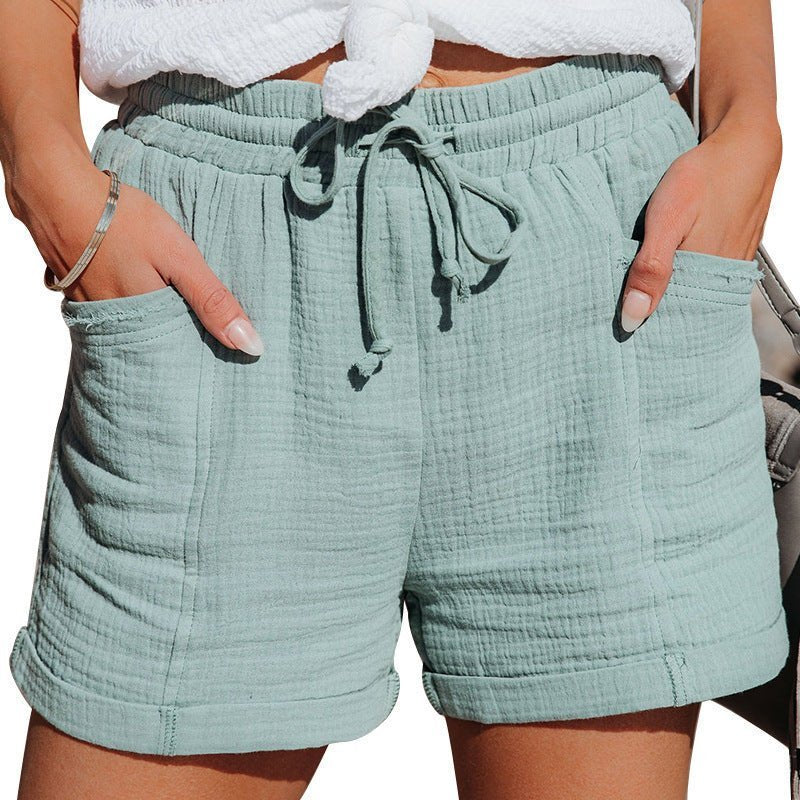 Trendy women's casual drawstring shorts with pockets, perfect for warm weather vacation outfits.