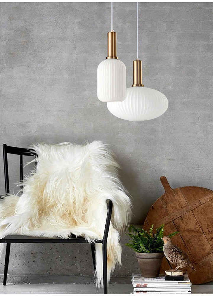 Vintage style ceiling lamp with intricate glass details, unlit view.