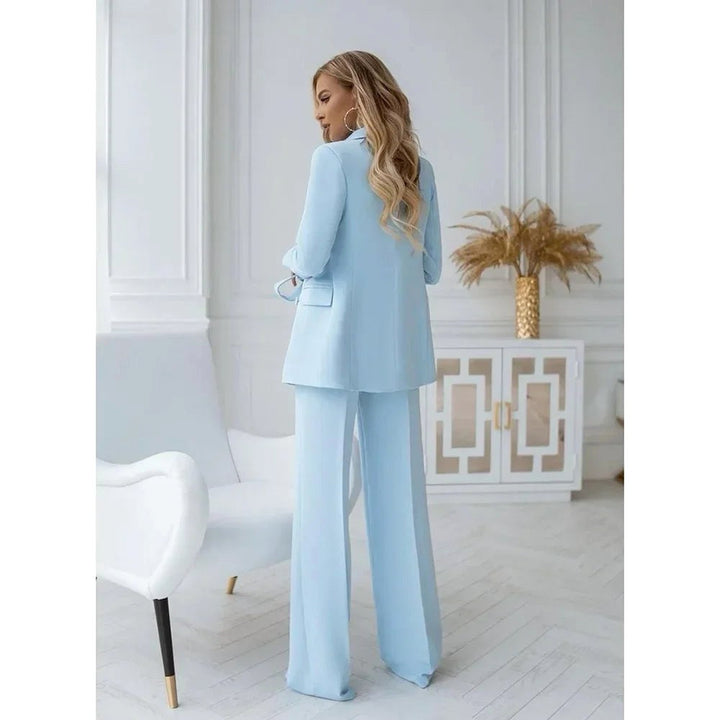 Professional women's double-breasted tailored blazer and matching straight leg pants suit for smart casual or business.