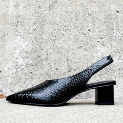 Close-up of women's comfortable heels: elegant croco orthopedic pumps with excellent arch support.