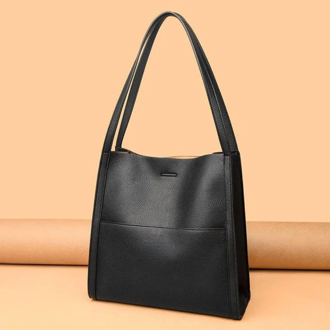 Women's spacious leather handbag, a stylish everyday tote with ample capacity for essentials.
