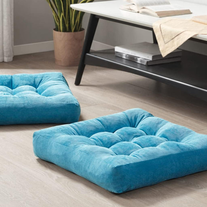 Elegant set of two large tufted corduroy meditation floor cushions for a mindful living room.