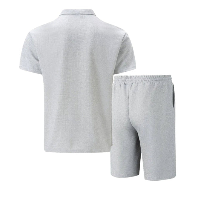 Men's fashion zip-neck polo & shorts set, versatile for casual summer outings or comfortable lounging.