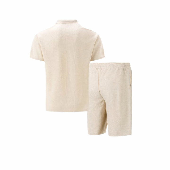 Men's zip-neck polo with matching drawstring shorts, a modern casual outfit. Comfortable for all-day wear.