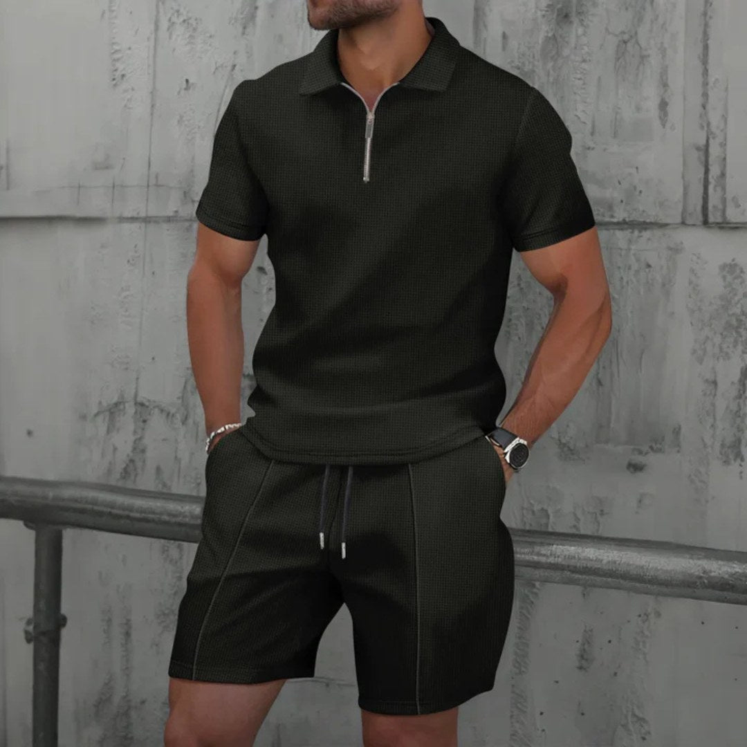 Man wearing an effortless casual men's zip-neck polo & shorts set. Perfect for relaxed summer days.