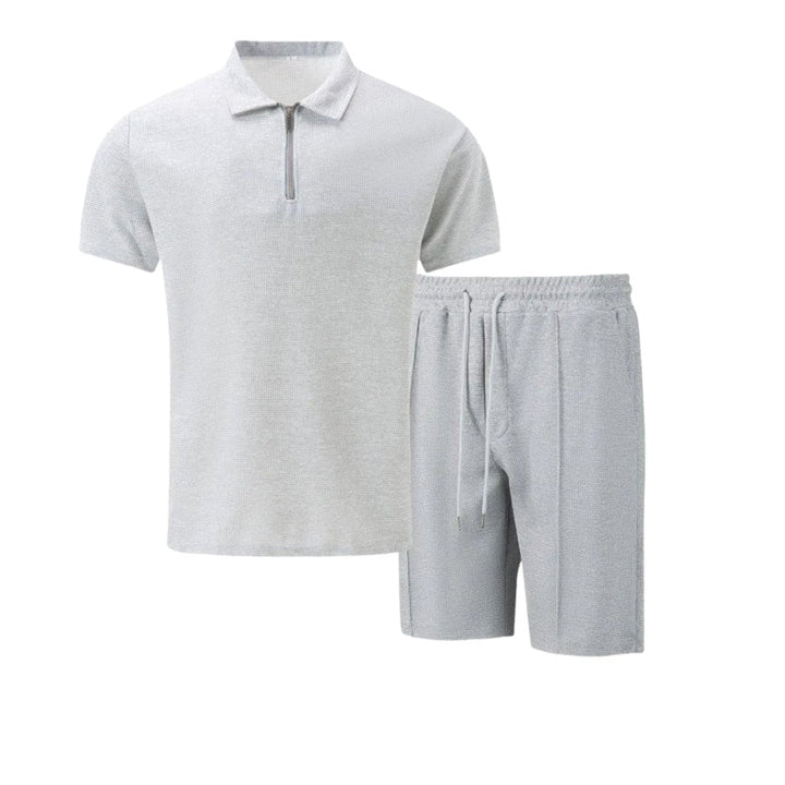 Men's comfortable two-piece travel wear set: zip-neck polo & matching shorts. Effortless style.