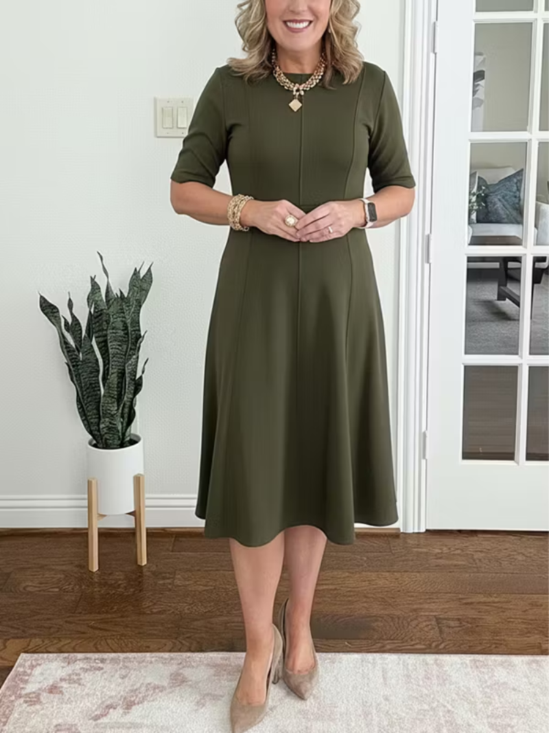 Classic women's midi fit-and-flare dress, elegant half sleeve cocktail attire with a sophisticated round neck.