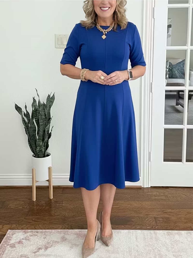 Sophisticated women's formal dress: a flattering fit-and-flare midi, half sleeve & round neck for cocktails.