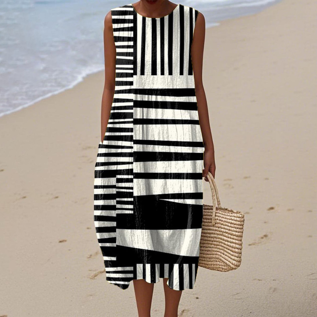 Women's polished abstract stripe midi beach dress. Flowy sleeveless summer vacation dress, comfortable resort wear.