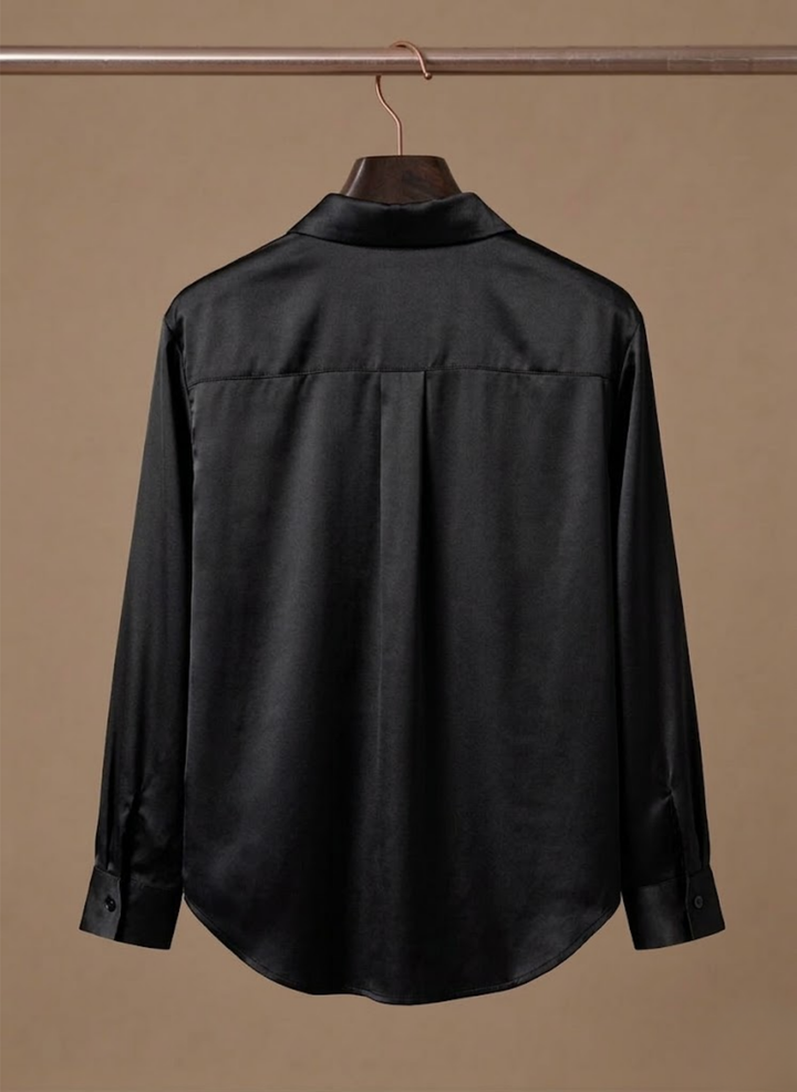 Chic women's long-sleeve blouse, button-up design for versatile office wear.