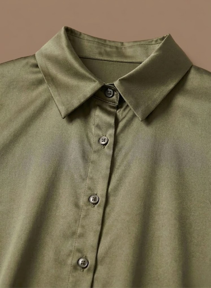 Elegant button-front women's blouse with long sleeves, perfect for office wear.