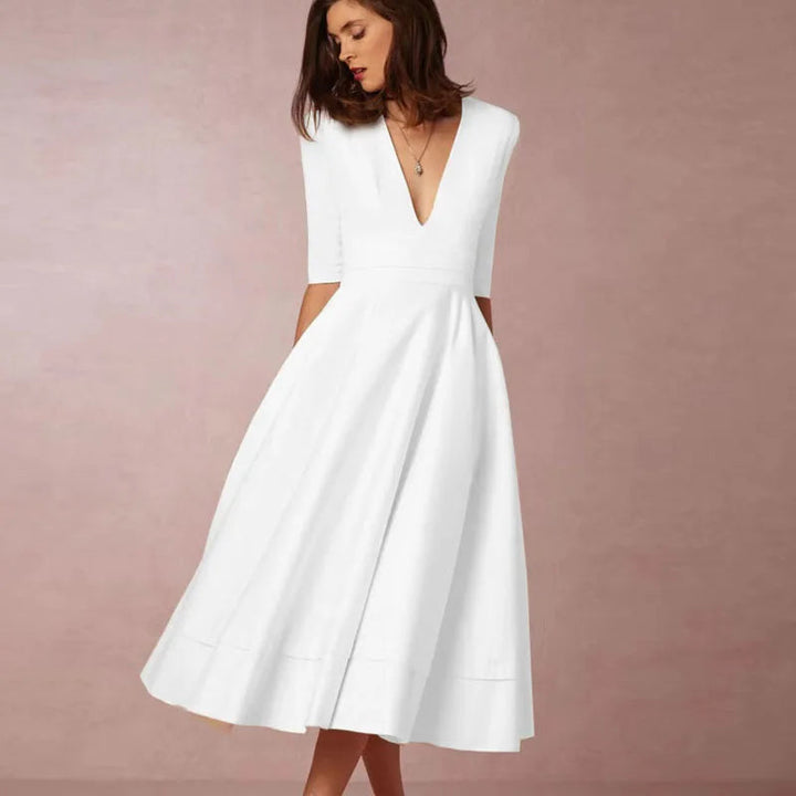 Modest & elegant A-line midi dress with a V-neck for women. Ideal for sophisticated evening wear & special occasions.