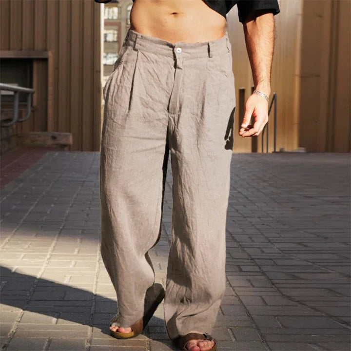 Modern men's wide leg pleated trousers, offering a relaxed fit and lightweight design for summer fashion.
